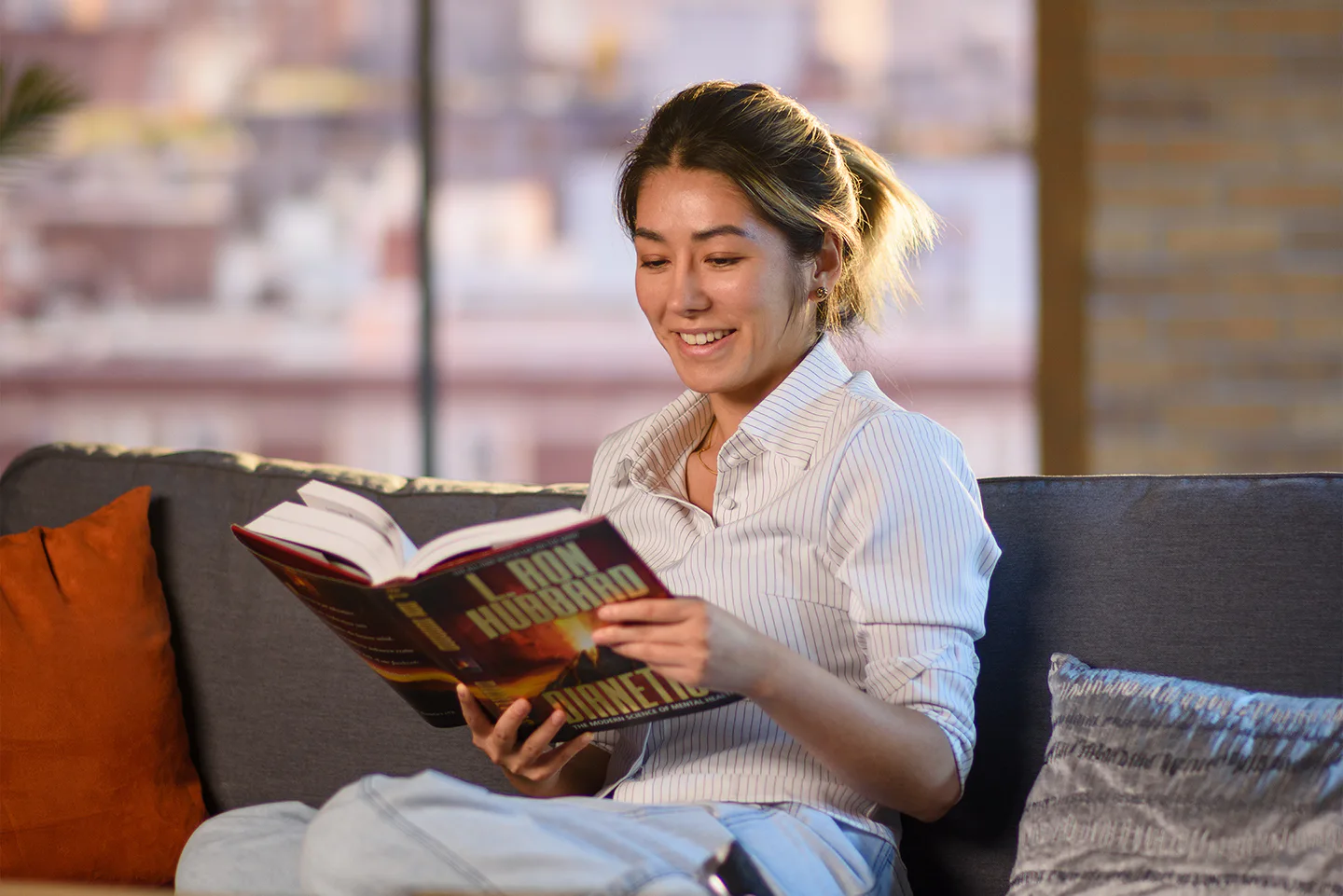 Person reading Dianetics
